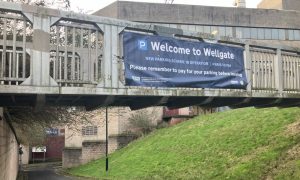 A banner advertising the Wellgate Centre ANPR parking charges on Kirk Lane., Dundee.