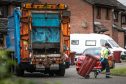 Bin collections in Dundee were disrupted by high winds on Friday. Image: Mhairi Edwards/DC Thomson