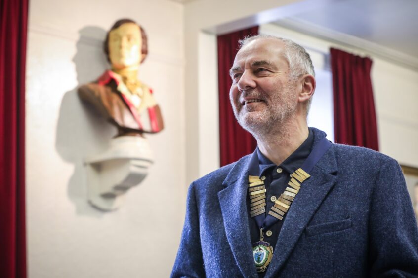 Dundee Burns Club president Jimmy Black beside the revered Burns bust.