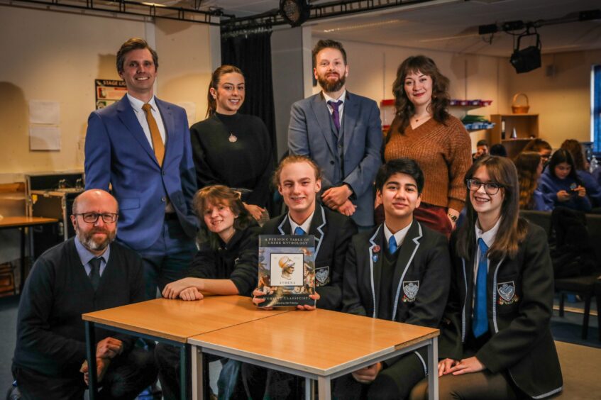 Arbroath classics enthusiasts George and Miri (back right) with the Monifieth High teachers and pupils who contributed to their book. Image: Mhairi Edwards/DC Thomson.