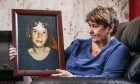 Allison Dewar at home with a portrait of her daughter Karen Dewar. Image: Mhairi Edwards/DC Thomson