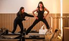 Co-owner of The Reformer Studio Shona Lees talks Poppy Watson through a move on the reformer.  Image: Mhairi Edwards/DC Thomson