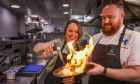 Food writer Rachel McConachie sets fire to the halibut with chef Rory MacCrimmon at The Adamson, St Andrews. Image: Mhairi Edwards/DC Thomson