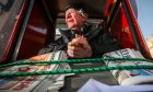 William Jarvie at his kiosk outside the Overgate. Image: Mhairi Edwards/DC Thomson