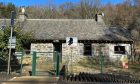 A front image of the Lineside Cottage behind the railway line near Pitlochry.