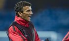 Roman Eremenko speaks to a CSKA Moscow team-mate during a training session.