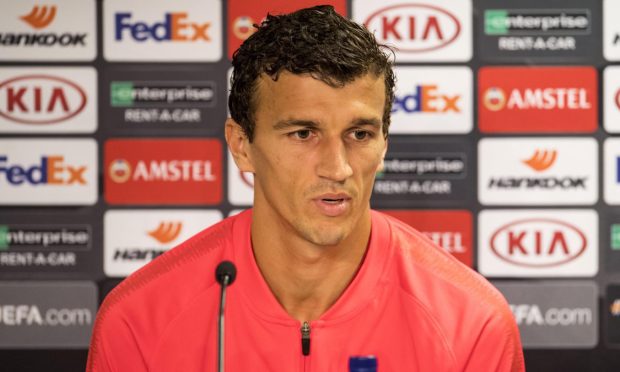 Roman Eremenko at a press conference.