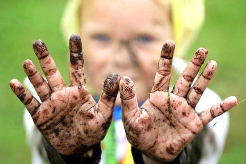 Child with filthy hands