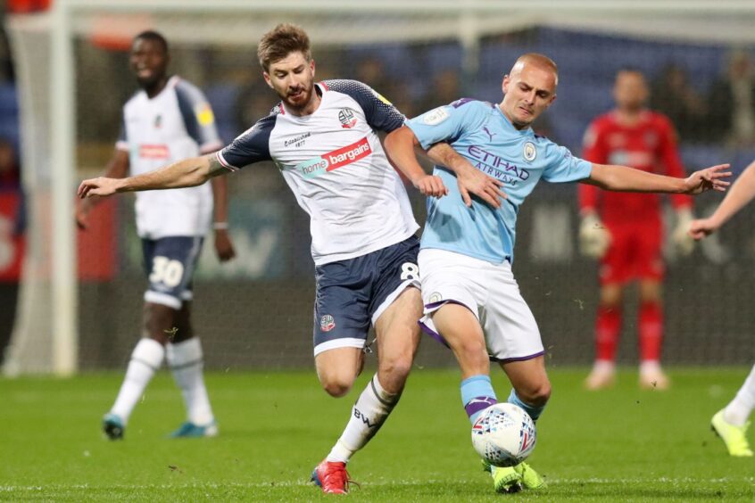 Lewis Fiorini, right, in action for Manchester City's U/23s.