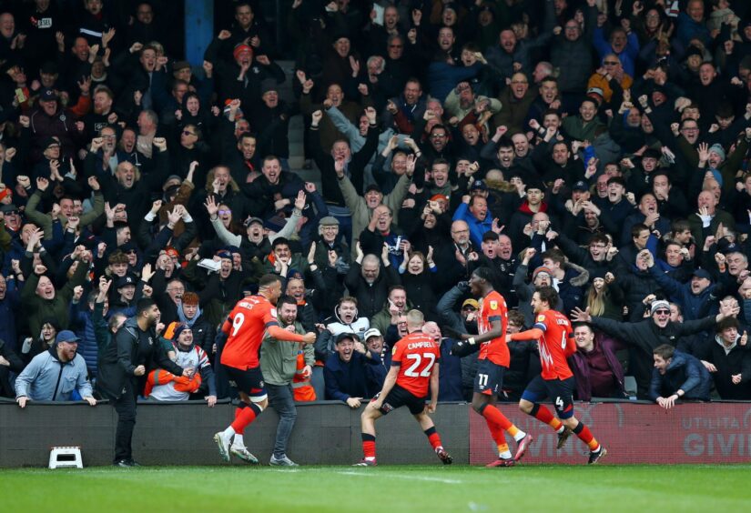 Allan Campbell, No22, celebrates a memorable strike against Luton's fierce rivals, Watford