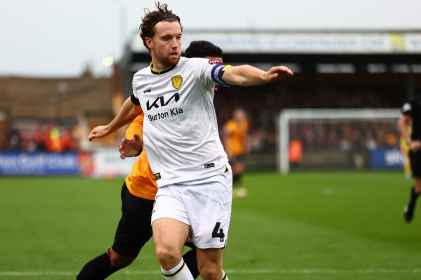 Elliot Watt in action for Burton Albion. 