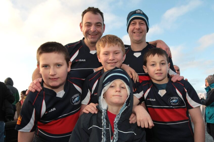 Some adults and youngsters in Dundee Eagles kit before taking part in the New Year's Day Dook in Broughty Ferry.