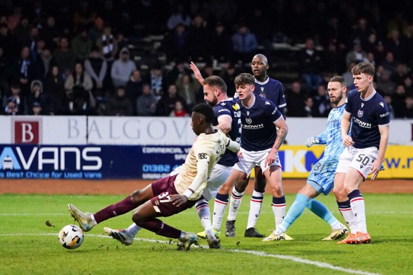 Musa Drammeh takes advantage of a Trevor Carson howler to make it 4-0. Image: Pete Summers/Shutterstock