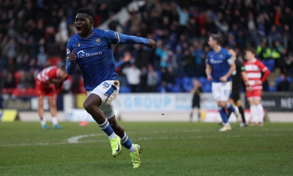 Adama Sidibeh runs off to celebrate his goal.