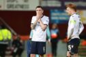 Dundee players after yet another defeat. Image: David Young/Shutterstock