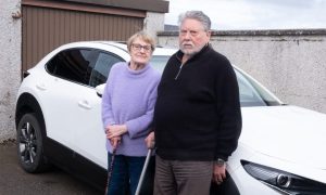 Bill and Lana Rollo from Forfar hit tyre trouble in the Angus darkness. Image: Paul Reid