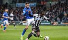 St Johnstone's Drey Wright challenges St Mirren's Elvis Bwomono.