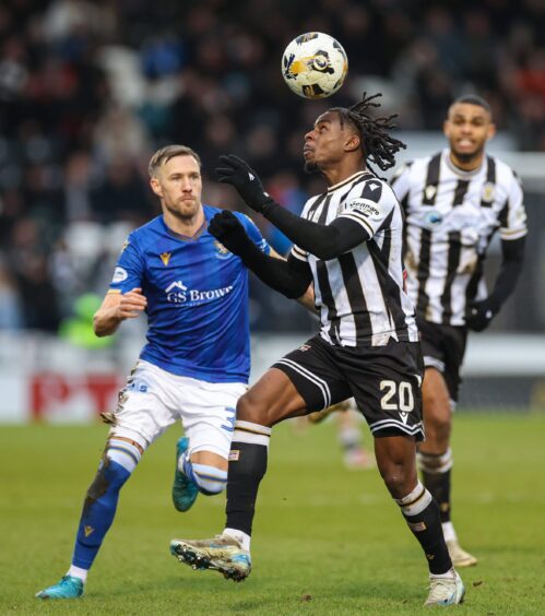 Barry Douglas keeps an eye on a St Mirren opponent.