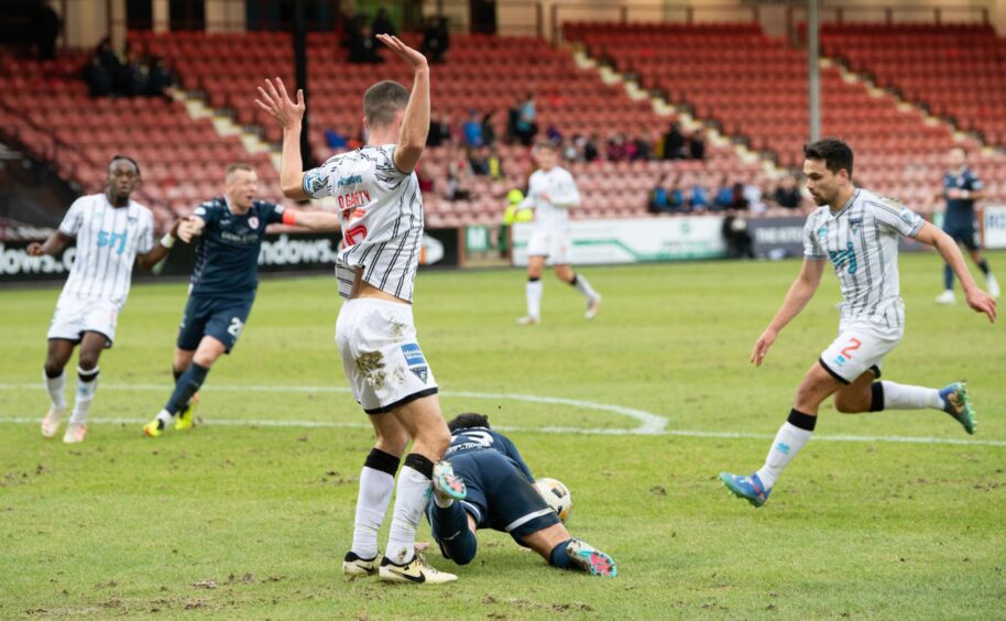 Tommy Fogarty brings down Dylan Easton for Raith Rovers' penalty