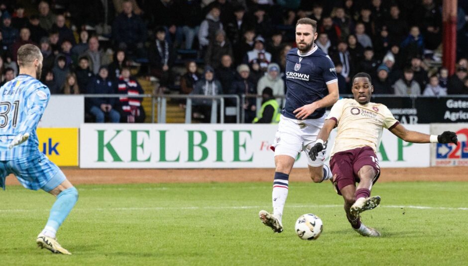 Elton Kabangu was too quick for Clark Robertson as the striker scored the crucial third goal. Image: Mark Scates/SNS