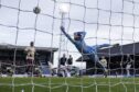 Blair Spittal rattles in the goal of the game as Hearts ran riot at Dundee. Image: Mark Scates/SNS