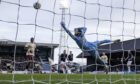 Blair Spittal rattles in the goal of the game as Hearts ran riot at Dundee. Image: Mark Scates/SNS