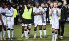 The Dunfermline players walk round the East End Park pitch as they celebrate their Fife derby triumph over Raith Rovers.