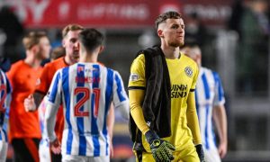 A dejected Jack Walton makes his way off the pitch