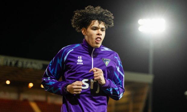 Jeremiah Chilokoa-Mullen warms up before a Dunfermline Athletic match.