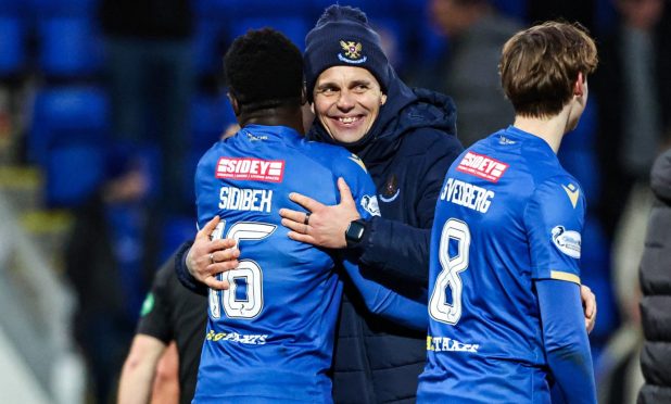 Adama Sidibeh is congratulated by his manager, Simo Valakari.