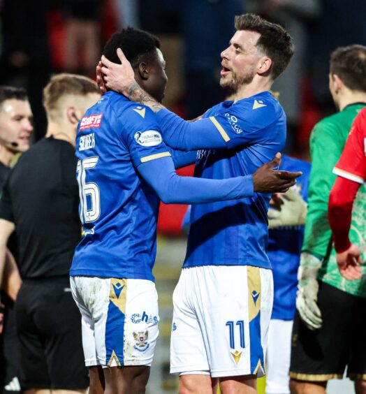 Adama Sidibeh and Graham Carey celebrate at full-time.