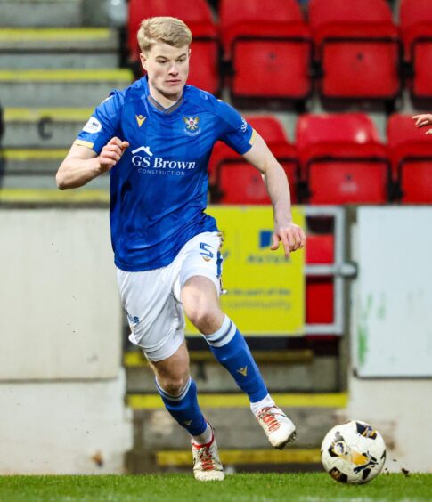 Zach Mitchell brings the ball out of defence for St Johnstone.