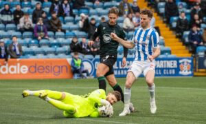 St Johnstone goalkeeper Andy Fisher bravely plucks a dangerous cross off Marley Watkins' toes. Image: Sammy Turner/SNS