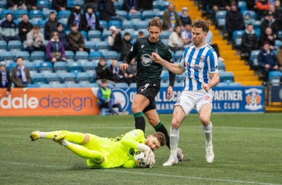 St Johnstone goalkeeper Andy Fisher bravely plucks a dangerous cross off Marley Watkins' toes. Image: Sammy Turner/SNS