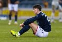 Dundee's Seb Palmer-Houlden looks dejected at full-time against Aberdeen. Image: Ross Parker/SNS