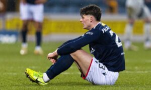 Dundee's Seb Palmer-Houlden looks dejected at full-time against Aberdeen. Image: Ross Parker/SNS