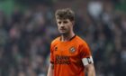 Dundee United captain Ross Docherty in action against Celtic