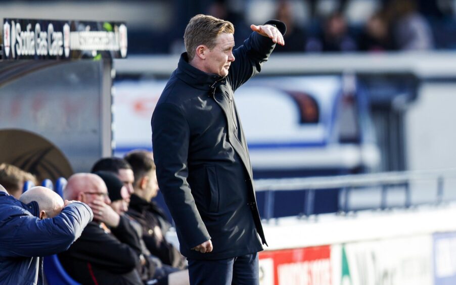 Raith Rovers boss Barry Robson squints into the sun.