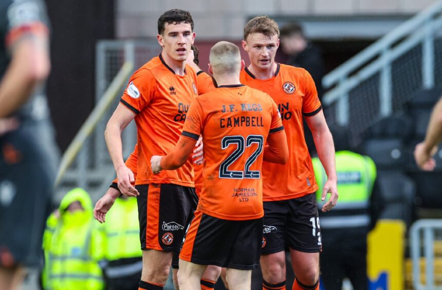 Dundee United players celebrate their opener