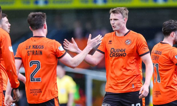 Sam Dalby, right, congratulates goal creator Ryan Strain.