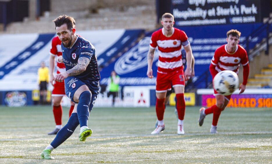 Dylan Easton sweeps in Raith Rovers' opening goal from the penalty spot.