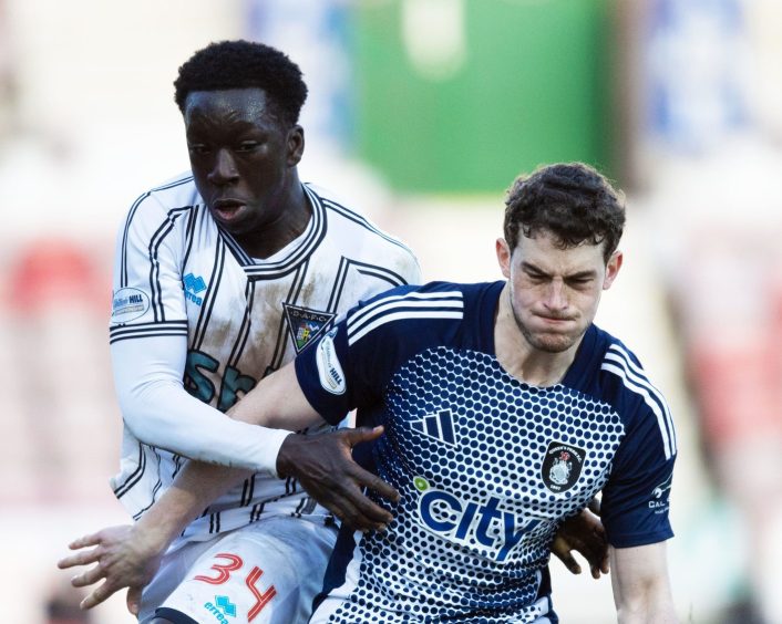 Pars striker Ephraim Yeboah (left) and Queen's Park's Will Tizzard battle for possession.