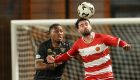 Dunfermline defender Kieran Ngwenya challenges Hamilton Accies opponent Reghan Tumilty for a header.