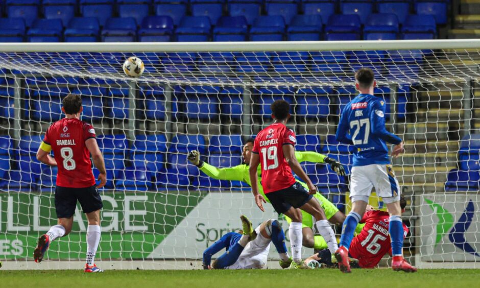 Ross County's Jordan Amissah denies Sam Curtis.