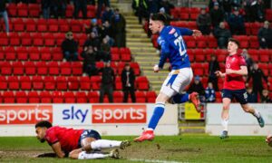 Makenzie Kirk smashes home St Johnstone's winning goal.