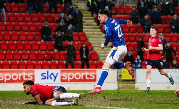 Makenzie Kirk smashes home St Johnstone's winning goal.