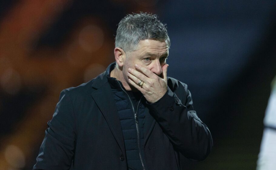 Tony Docherty is dejected after Dundee's defeat to Motherwell.