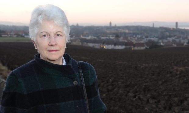 Penny Uprichard with St Andrews in the background