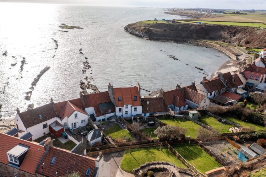 The home sits above the beach