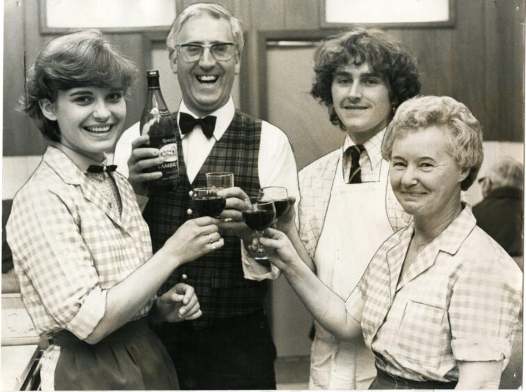 Ciano Soave and three members of staff raise a glass at the Washington in 1982.